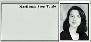A yearbook portrait of a young white woman with shoulder length dark hair. 